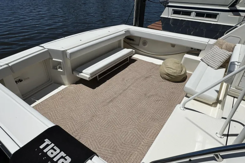 Slide: The Image of Spacious deck of 1995 Tiara Yachts 4300 Open, featuring comfortable seating and elegant design. - 9