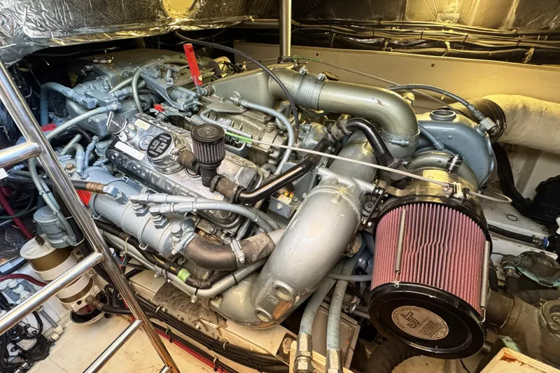 Slide: The Image of Engine compartment of a 1995 Tiara Yachts 4300 Open, showcasing detailed mechanical components. - 32