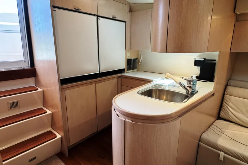 Slide: The Image of Luxurious 1995 Tiara Yachts 4300 Open interior kitchen with modern amenities and sleek design. - 21
