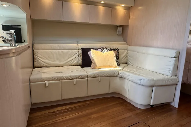 Slide: The Image of Luxurious interior of a 1995 Tiara Yachts 4300 Open with cream leather seating. - 19