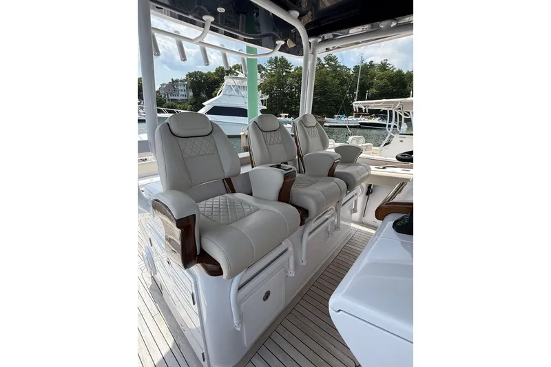 Slide: The Image of Luxury seating on a 2025 Jupiter 43 boat, featuring elegant design and waterfront view. - 41