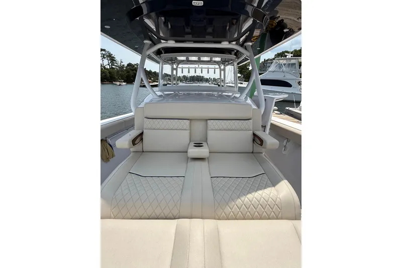 Slide: The Image of Luxurious seating on a 2025 Jupiter 43 boat, featuring elegant diamond-pattern upholstery. - 44