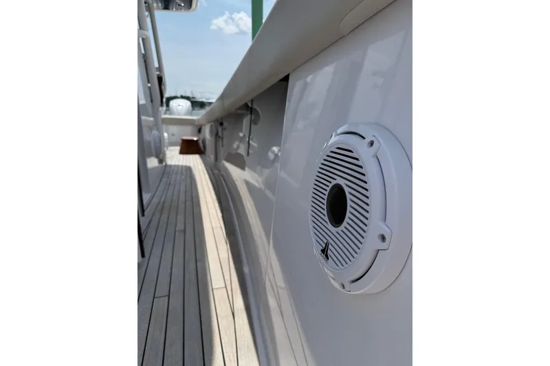 Slide: The Image of Side view of 2025 Jupiter 43 boat with speaker and wooden deck. - 45