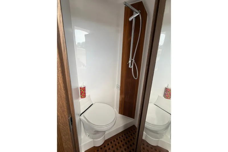 Slide: The Image of Modern bathroom in 2025 Jupiter 43 model, featuring a sleek shower and compact toilet design. - 33