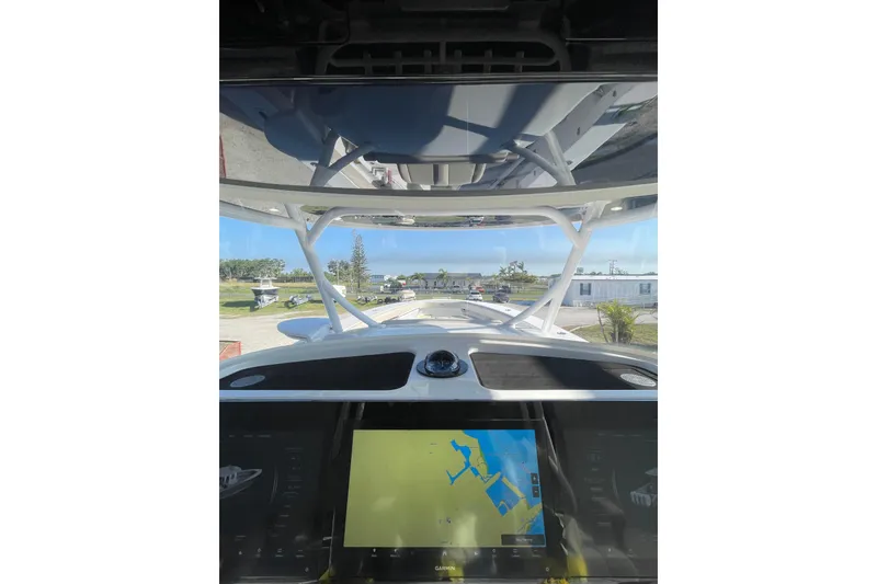 Slide: The Image of 2025 Jupiter 43 boat cockpit with navigation display, showcasing modern design and technology. - 11