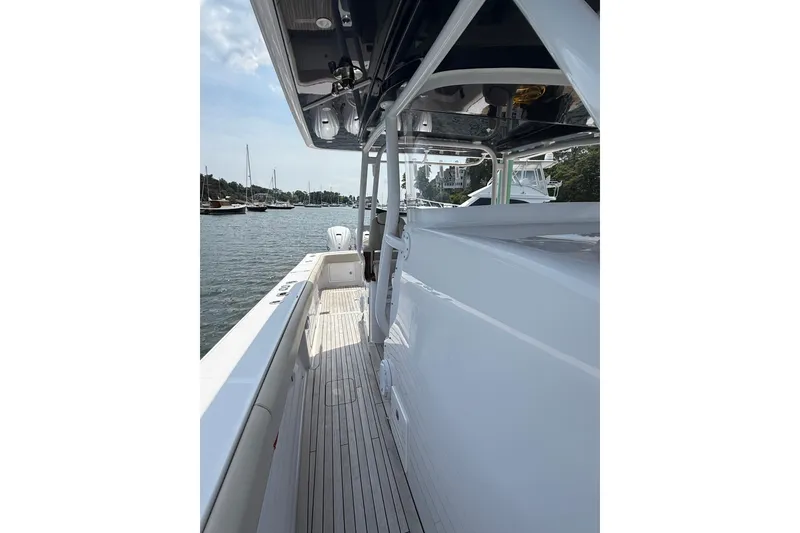 Slide: The Image of 2025 Jupiter 43 boat deck view, showcasing sleek design and waterfront scenery. - 42