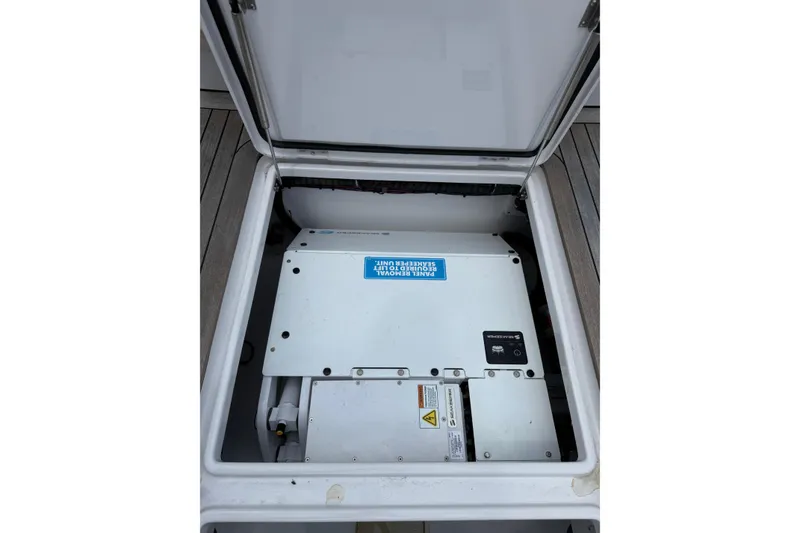 Slide: The Image of Open compartment revealing a Jupiter 43 model 2025 electrical panel on a boat. - 38