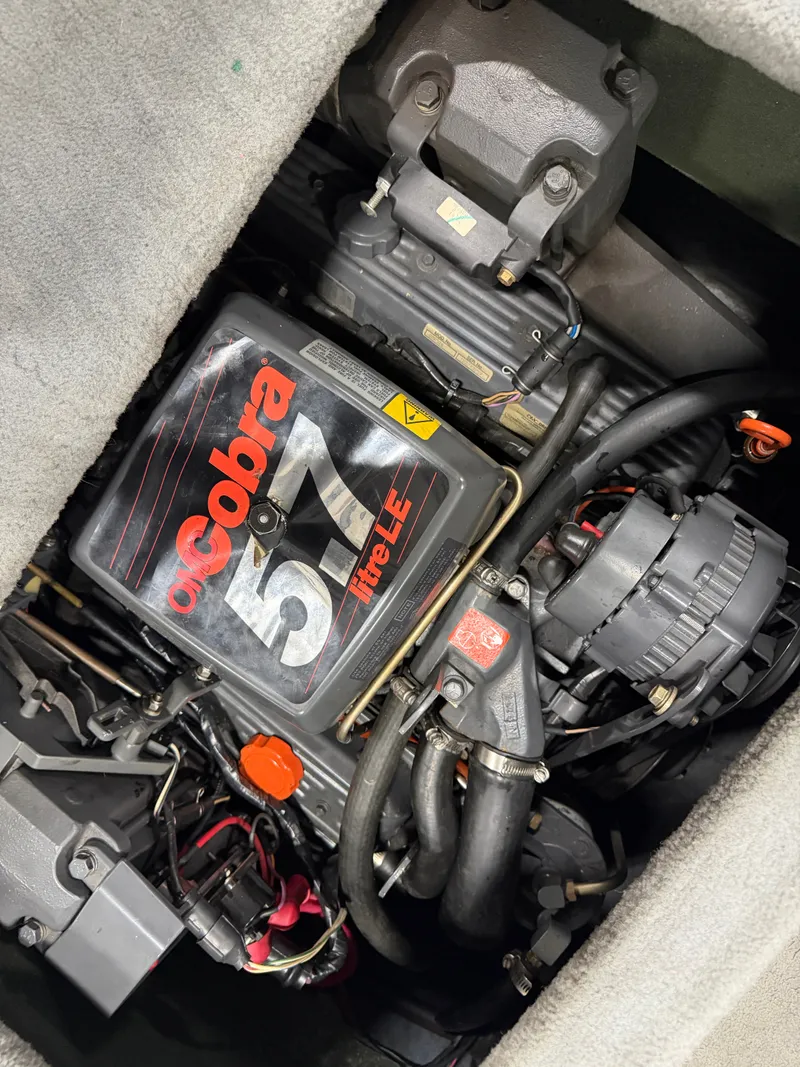 Slide: The Image of Engine compartment of a 1992 Four Winns 225 Sundowner with a Cobra 5.7 engine. - 17