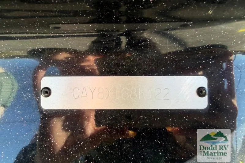 Slide: The Image of 2021 Caymas CX 18 SS boat identification plate with serial number, displayed at Dodd RV Marine. - 21