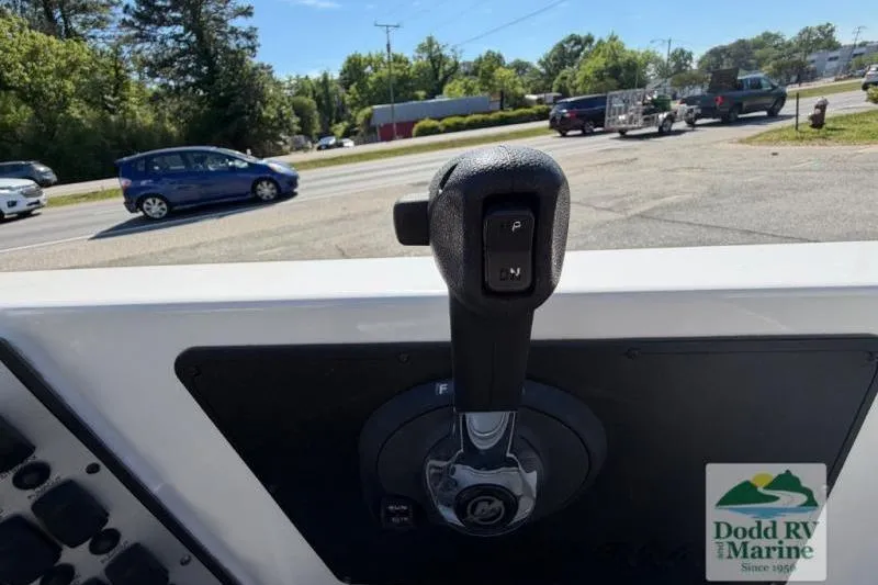 Slide: The Image of 2021 Caymas CX 18 SS boat throttle control, Dodd RV & Marine logo visible. - 11