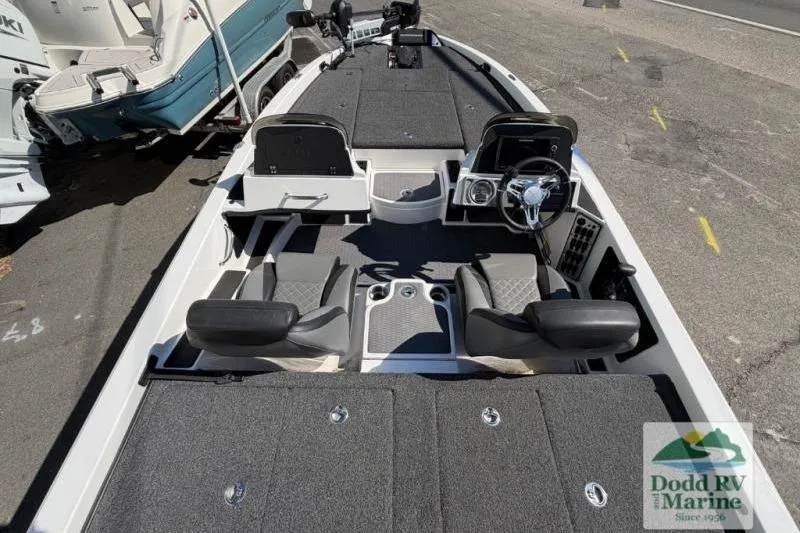 Slide: The Image of 2021 Caymas CX 18 SS boat interior with dual seats and steering console. - 6