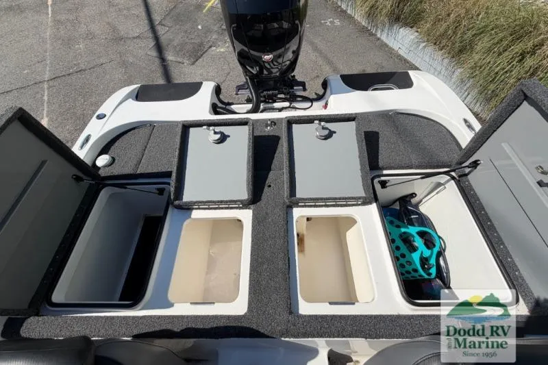 Slide: The Image of 2021 Caymas CX 18 SS boat storage compartments and engine, displayed at Dodd RV Marine. - 16