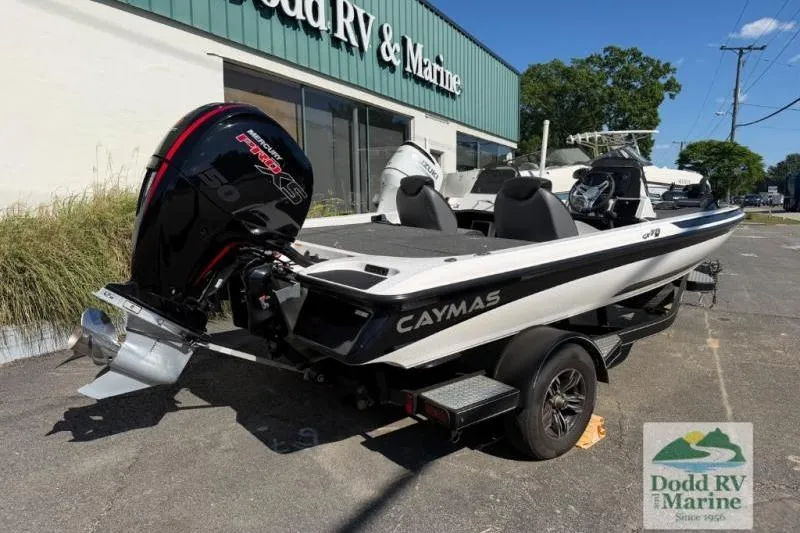 Slide: The Image of 2021 Caymas CX 18 SS boat at Dodd RV & Marine dealership, featuring a powerful outboard motor. - 4
