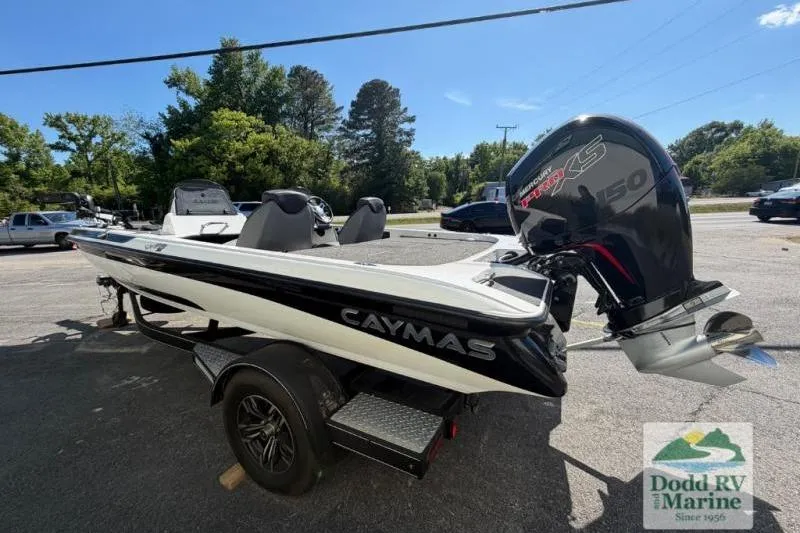 Slide: The Image of 2021 Caymas CX 18 SS boat with Mercury 150 engine, parked outdoors at Dodd RV Marine. - 3