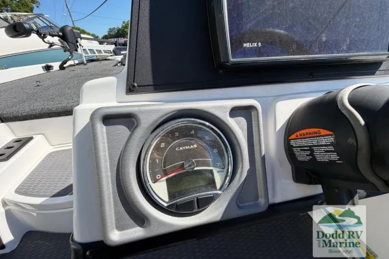 Slide: The Image of Dashboard of 2021 Caymas CX 18 SS boat with gauge and Helix 9 display. - 9
