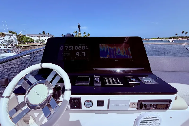 Slide: The Image of Cockpit of 2021 Azimut Fly 60 yacht with navigation controls and display. - 36