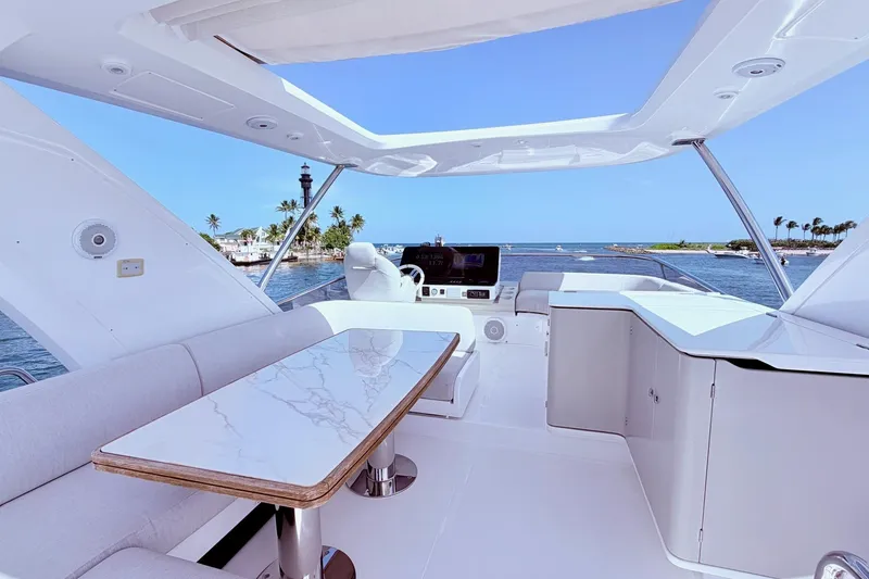 Slide: The Image of Luxurious 2021 Azimut Fly 60 yacht interior with elegant seating and ocean view. - 29