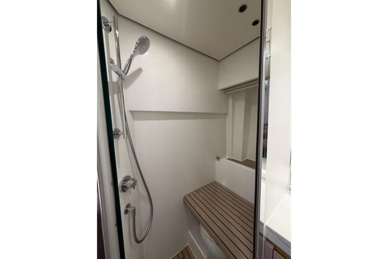 Slide: The Image of Modern shower area in 2021 Azimut Fly 60 yacht, featuring sleek design and chrome fixtures. - 54