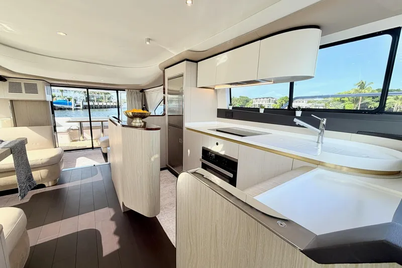 Slide: The Image of Luxurious interior of 2021 Azimut Fly 60 yacht with modern kitchen and seating area. - 16