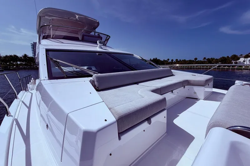 Slide: The Image of Azimut Fly 60 yacht, 2021 model, featuring sleek design and spacious deck seating. - 58