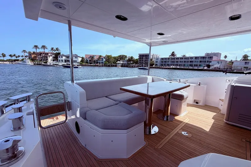 Slide: The Image of Luxurious 2021 Azimut Fly 60 yacht deck with elegant seating and waterfront view. - 61