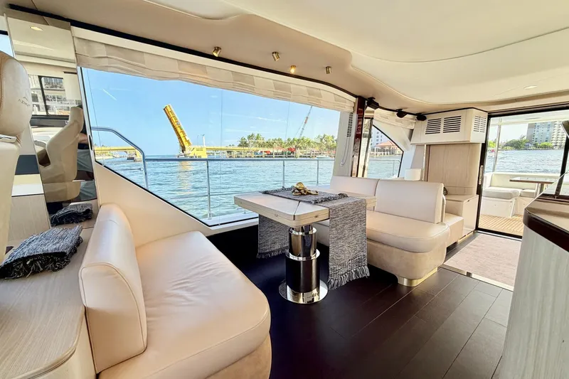 Slide: The Image of Luxurious interior of 2021 Azimut Fly 60 yacht with waterfront view and elegant seating. - 24