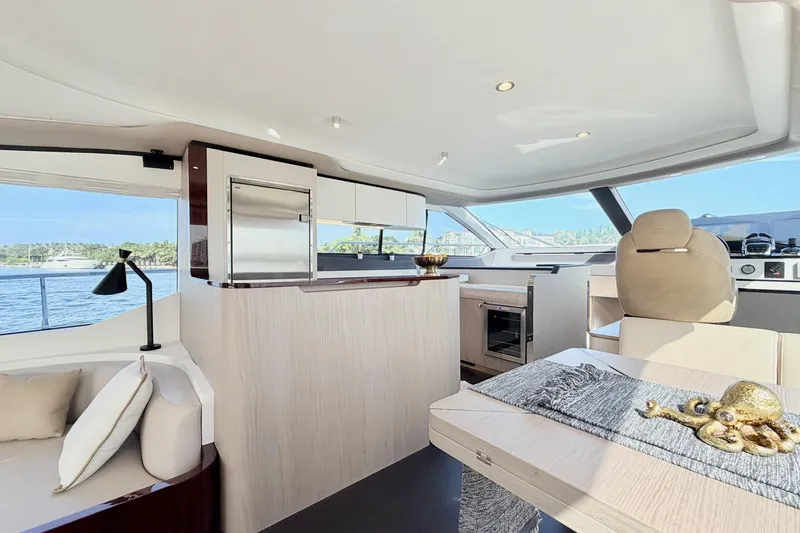 Slide: The Image of Luxurious interior of 2021 Azimut Fly 60 yacht with modern furnishings and scenic water view. - 22