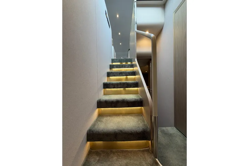 Slide: The Image of Luxurious carpeted staircase with ambient lighting on Azimut Fly 60 yacht, 2021 model. - 56