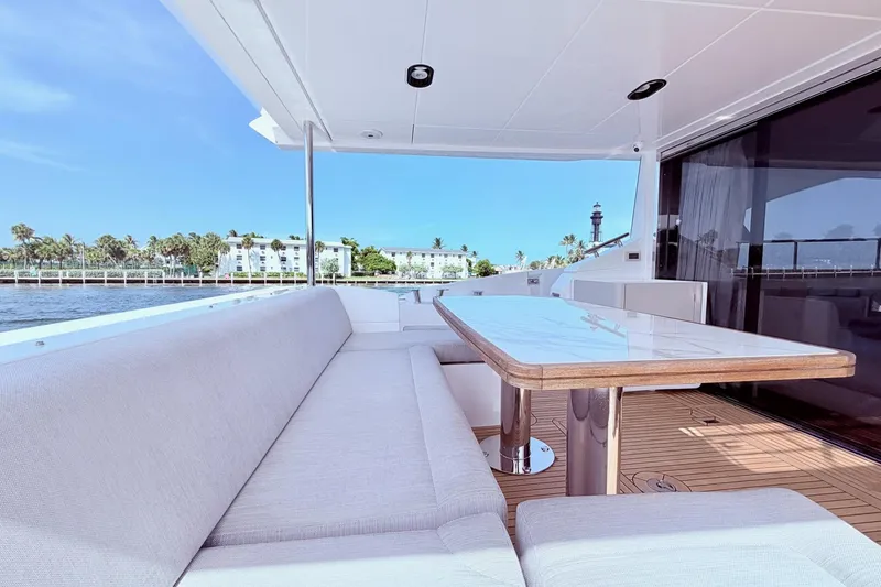 Slide: The Image of Azimut Fly 60 yacht deck with elegant seating and table, 2021 model. - 14