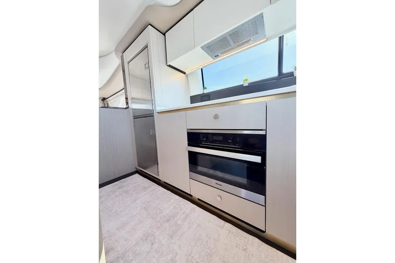Slide: The Image of Modern kitchen interior of 2021 Azimut Fly 60 yacht with sleek appliances. - 28
