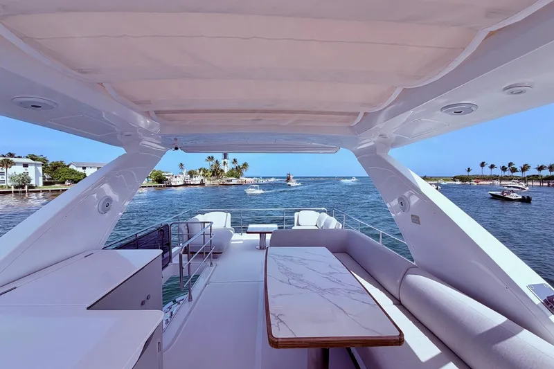 Slide: The Image of Luxurious 2021 Azimut Fly 60 yacht with elegant seating and ocean view. - 10