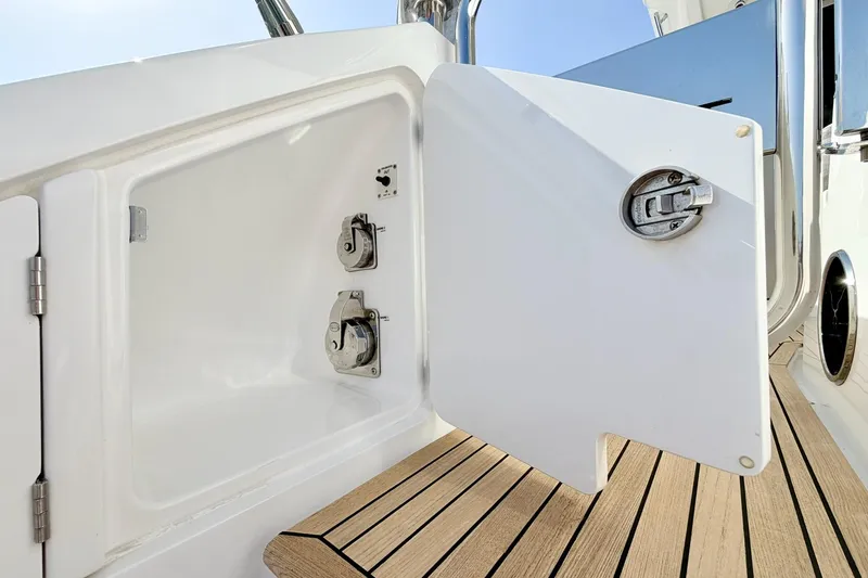 Slide: The Image of Open storage compartment on 2021 Azimut Fly 60 yacht with teak flooring. - 68