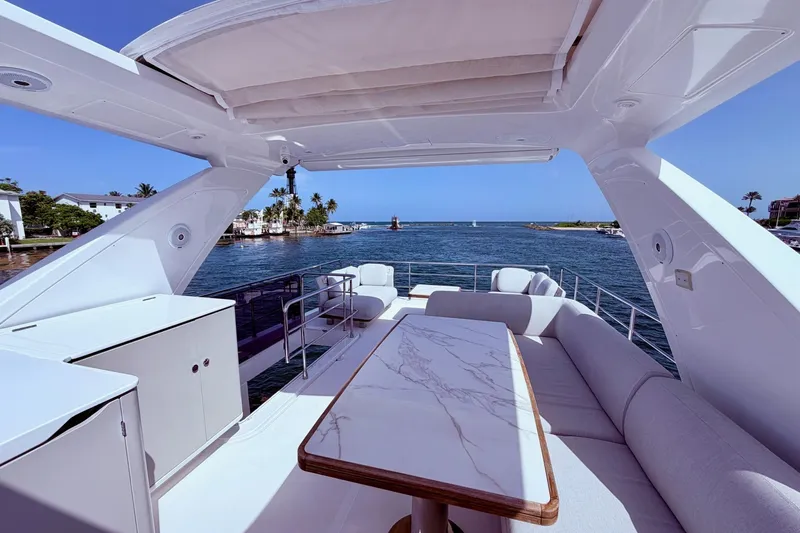 Slide: The Image of Luxurious 2021 Azimut Fly 60 yacht deck with elegant seating and ocean view. - 31