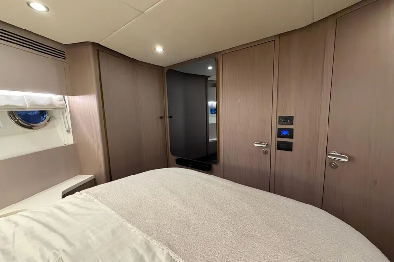 Slide: The Image of Luxurious bedroom interior of 2021 Azimut Fly 60 yacht with modern design elements. - 49