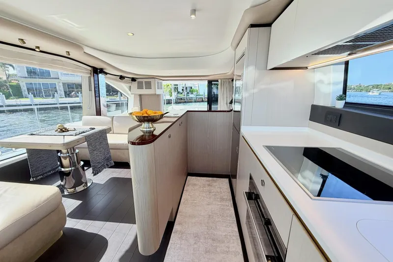Slide: The Image of Luxurious interior of 2021 Azimut Fly 60 yacht with modern kitchen and dining area. - 26