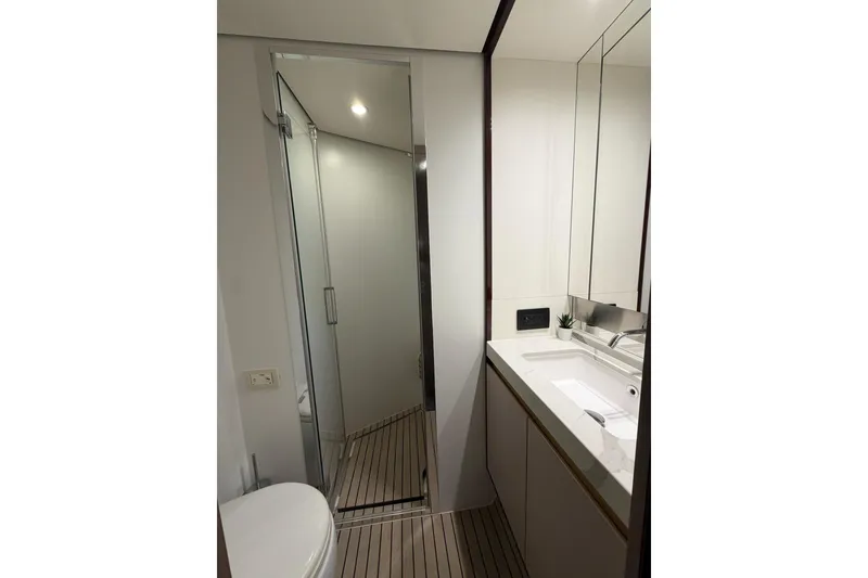 Slide: The Image of Modern bathroom interior on 2021 Azimut Fly 60 yacht, featuring sleek design and fixtures. - 52