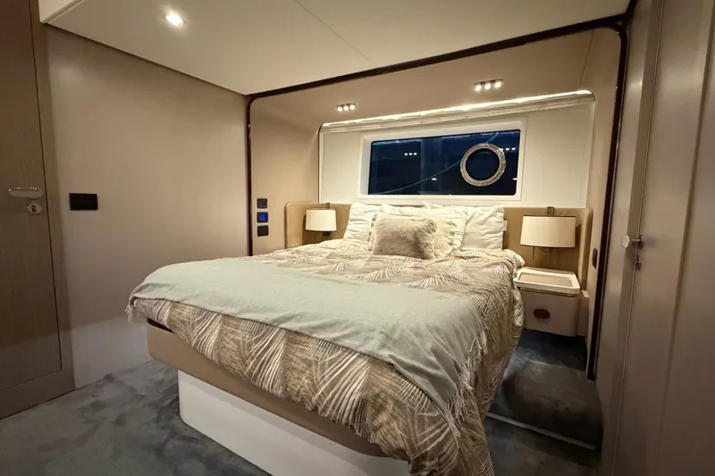 Slide: The Image of Luxurious bedroom interior of 2021 Azimut Fly 60 yacht with elegant bedding and ambient lighting. - 41