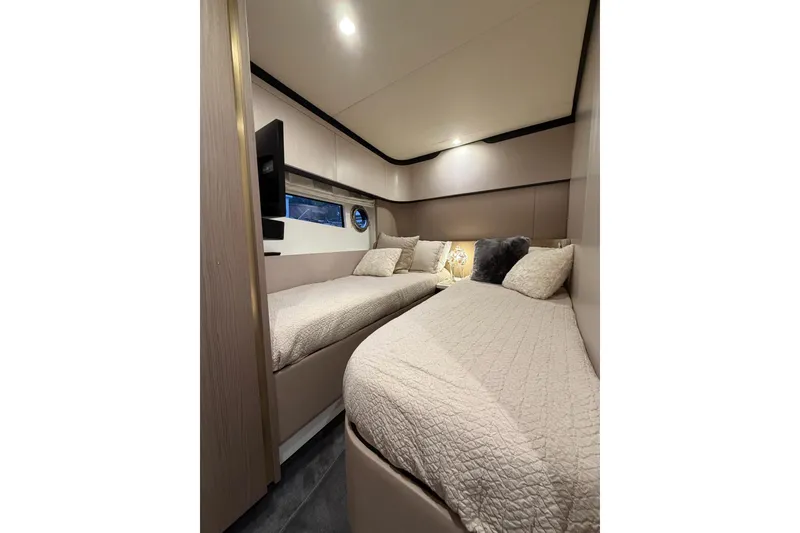 Slide: The Image of Luxurious twin cabin interior of 2021 Azimut Fly 60 yacht with cozy bedding. - 51