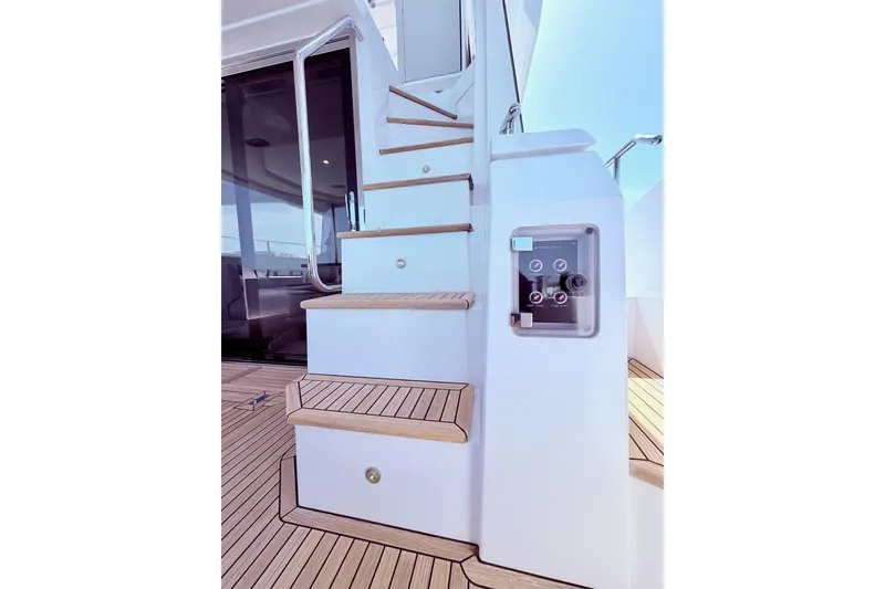Slide: The Image of Staircase on 2021 Azimut Fly 60 yacht with teak decking and control panel. - 62