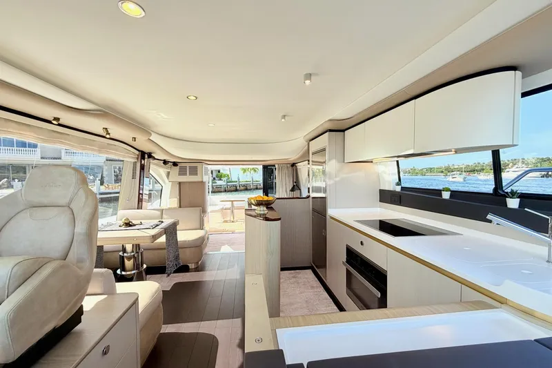 Slide: The Image of Luxurious interior of 2021 Azimut Fly 60 yacht with modern kitchen and seating area. - 25