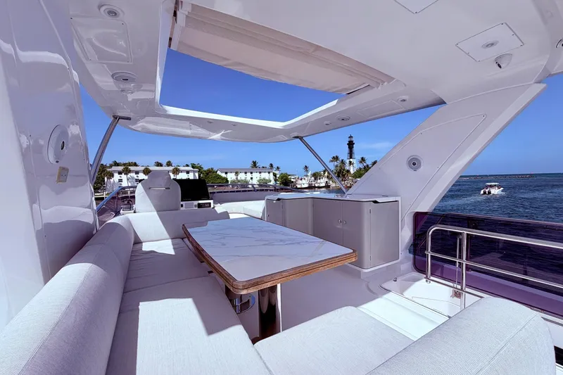 Slide: The Image of Luxurious 2021 Azimut Fly 60 yacht deck with elegant seating and ocean view. - 11