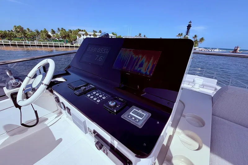 Slide: The Image of Cockpit view of 2021 Azimut Fly 60 yacht with advanced navigation controls. - 35