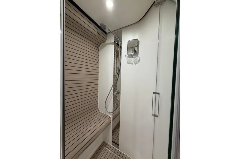 Slide: The Image of Luxurious shower in 2021 Azimut Fly 60 yacht with modern design and wood accents. - 55