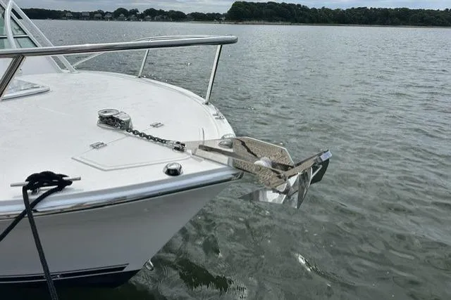 Slide: The Image of 2019 Albemarle 25 Express boat anchored on calm water. - 30
