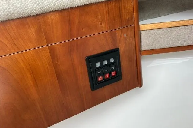 Slide: The Image of Control panel on 2019 Albemarle 25 Express boat with wooden interior. - 25