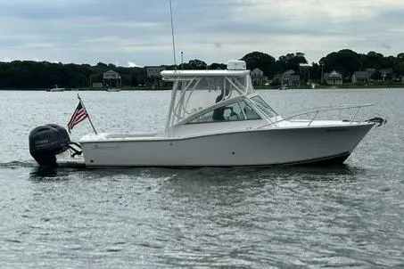 Slide: The Image of 2019 Albemarle 25 Express boat on calm water with American flag. - 7