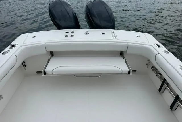 Slide: The Image of 2019 Albemarle 25 Express boat with dual engines, featuring a spacious deck and seating area. - 21