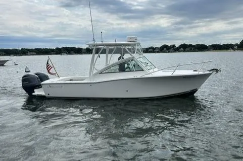 Slide: The Image of 2019 Albemarle 25 Express boat on calm water under cloudy sky. - 5