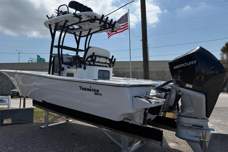 Slide: The Image of 2027 Tidewater 2500 Carolina Bay boat with Mercury engine, displayed outdoors. - 6