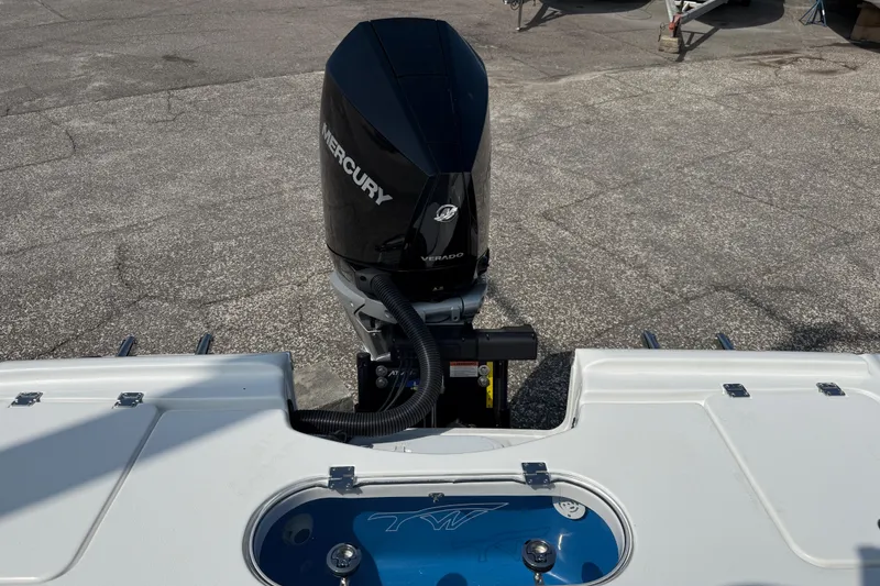 Slide: The Image of 2027 Tidewater 2500 Carolina Bay boat with Mercury outboard motor, rear view. - 7